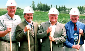  4 men holding shovels