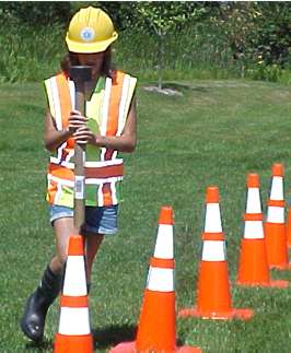 Student at Camp Mn/DOT with traffic cones
