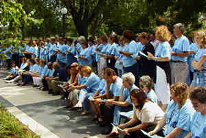 Group in blue t-shirts singing