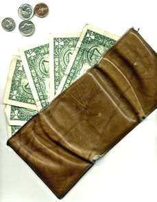 Wallet with dollar bills, coins protruding