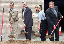 Four people & shovels at St. Cloud groundbreaking