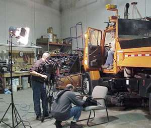 Crew filming inside truck station 