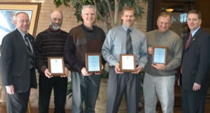 6 men holding awards