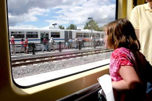 Girl looking out window of train