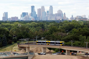 Train on overpass, Mpls skyline in background