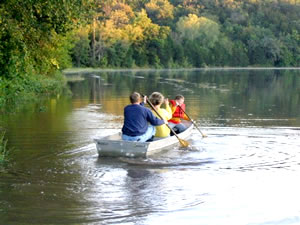 3 people in a canoe