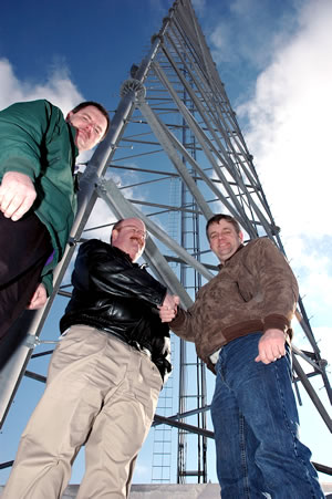 3 men & radio tower