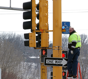 Man installing stoplight feature