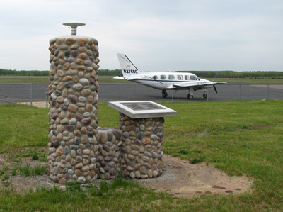 Photo of a Continuously Operating Reference Stations at the Siren, Wisc. airport.