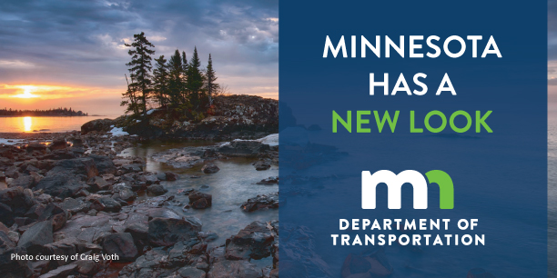 Photo of Minnesota landscape with MnDOT's new logo superimposed. New logo=small white m connected to small green n with words Department of Transportation beneath it.