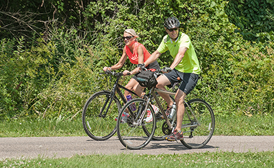 Two bike riders on a trail.