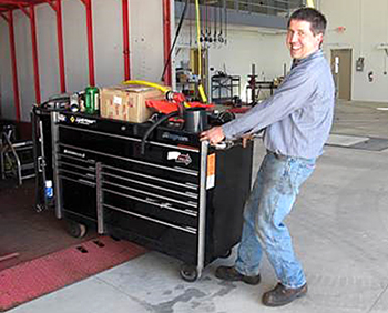 David Geise at work bench in new Little Falls truck station.