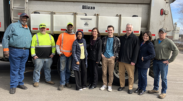 Photo: Rep. Ilhan Omarand and Commissioner Daubenberger, pose for a group shot with Blizzo. 