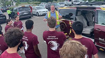 Photo: Brian Davis from University of Minnesota and students.