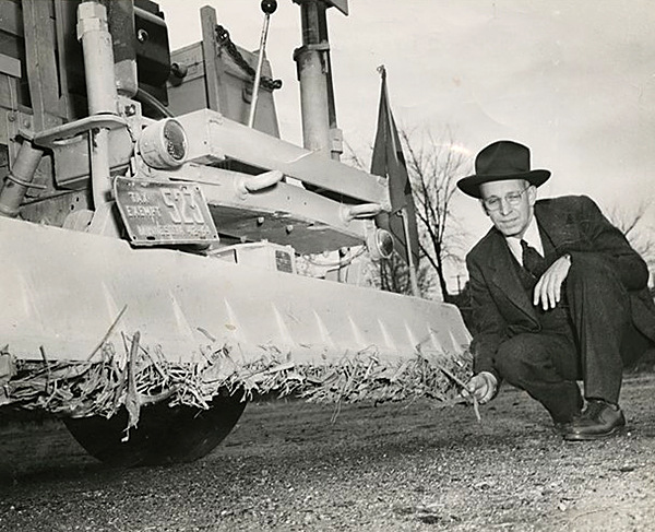 Photo: MnDOT employee with a road magnet in 1948.